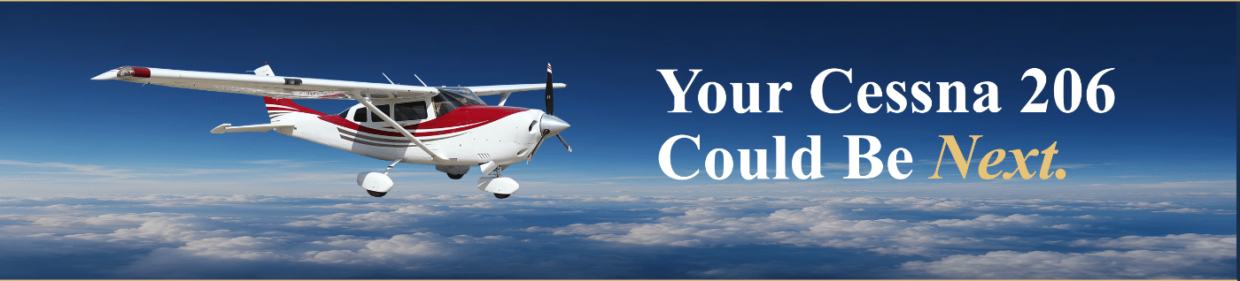 Cessna 206 flying above the clouds